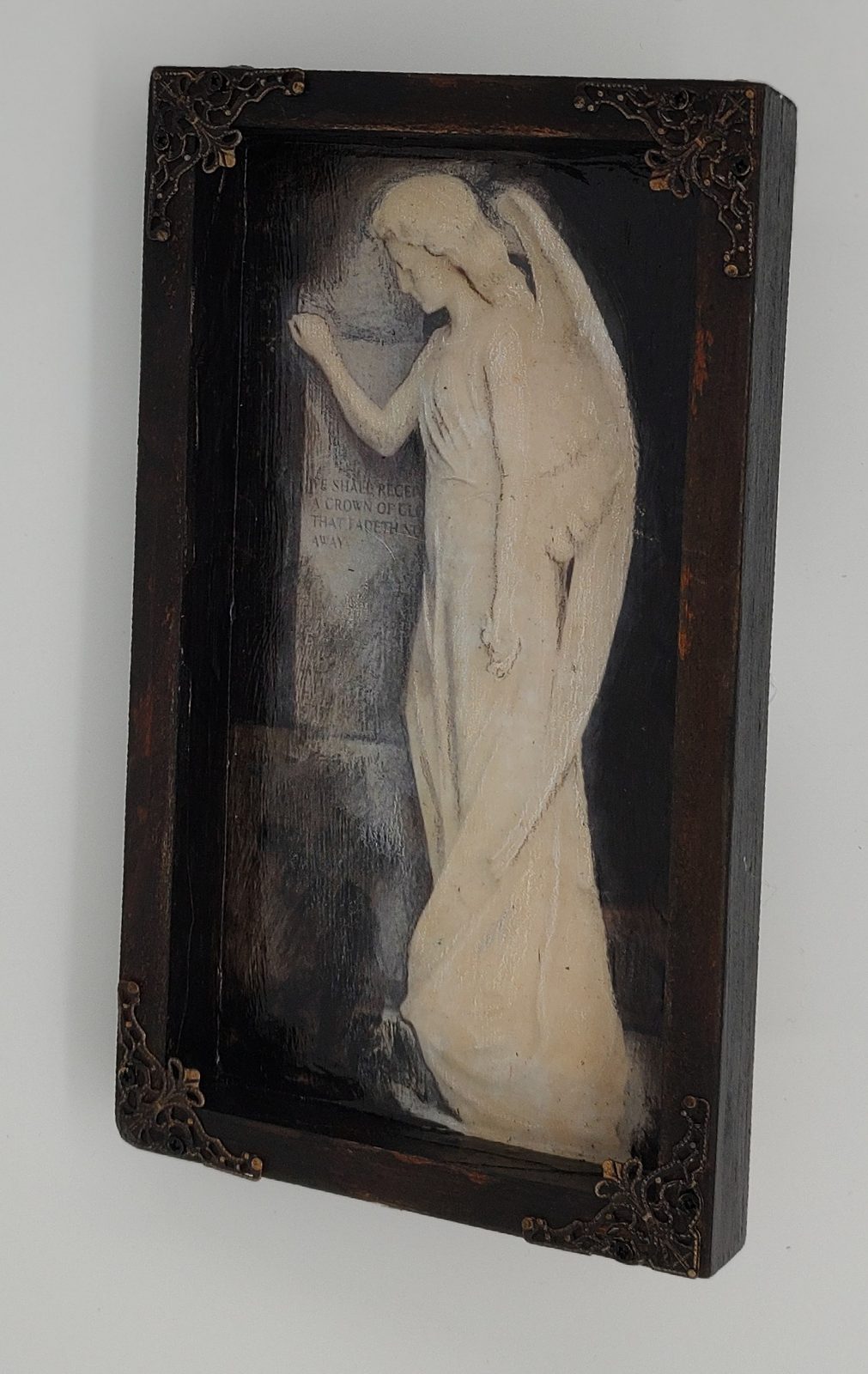 An angel shadowbox by Anne El-Habre